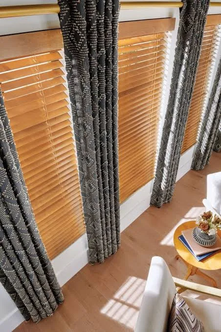 Wood blinds paired with patterned drapery